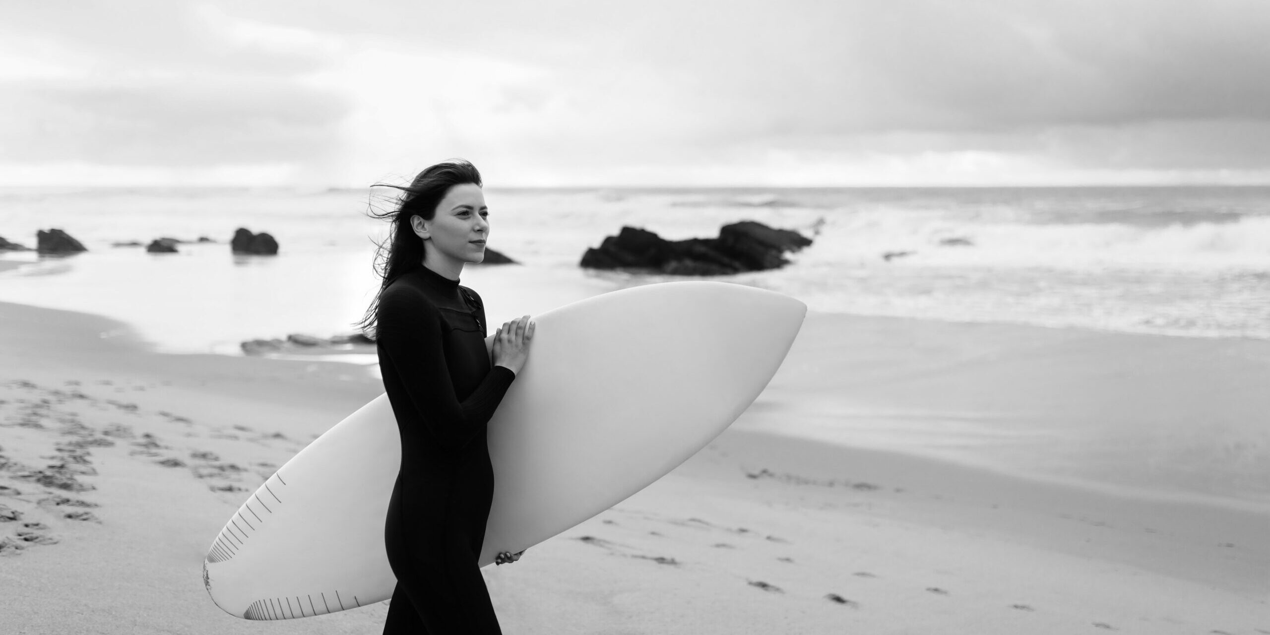 11. young-beautiful-woman-with-surfboard-walking-on-be-2023-02-21-03-49-06-utc