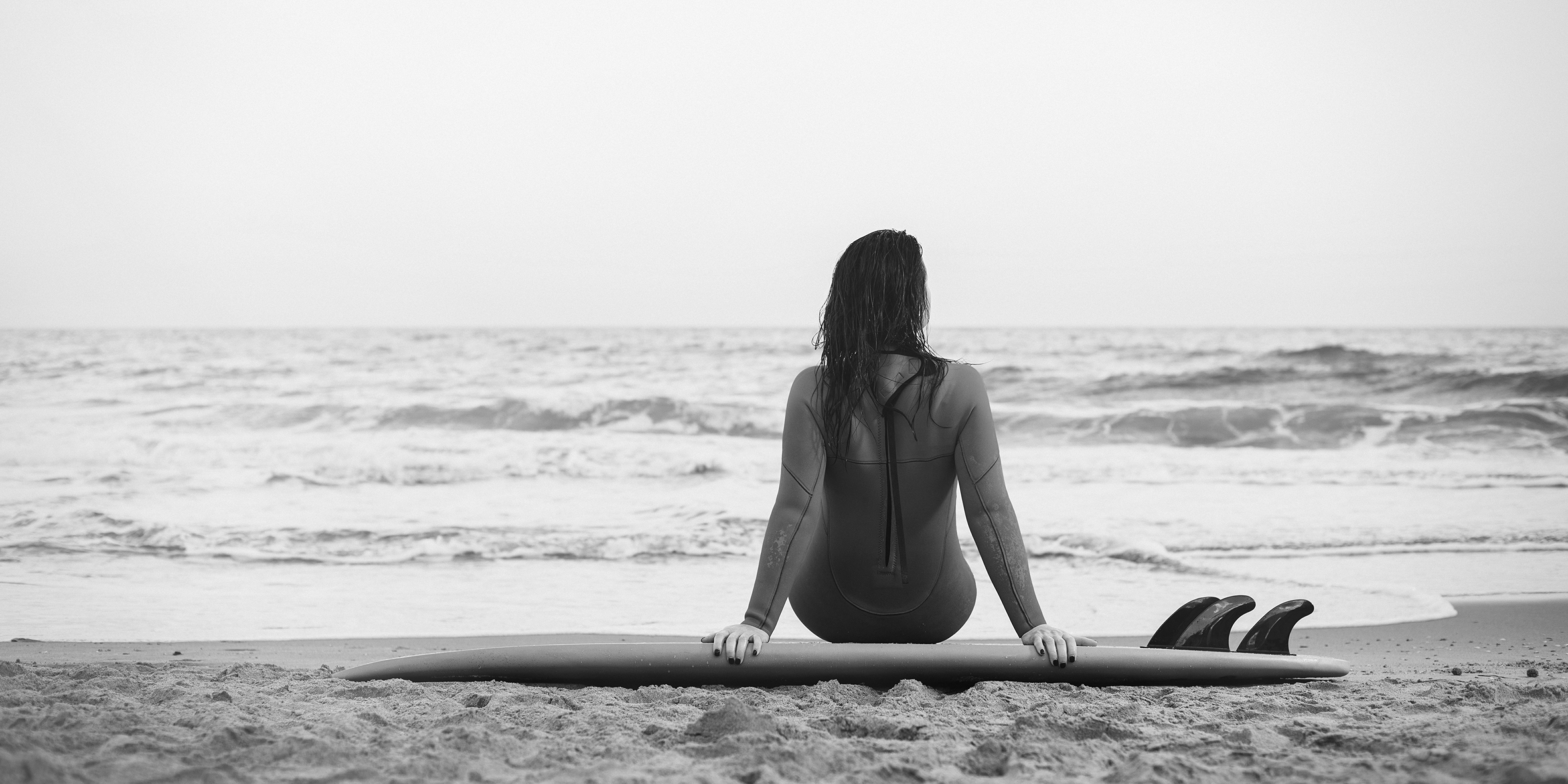 17. surfer-girl-walking-with-board-on-the-sandy-beach-2022-12-23-04-09-31-utc